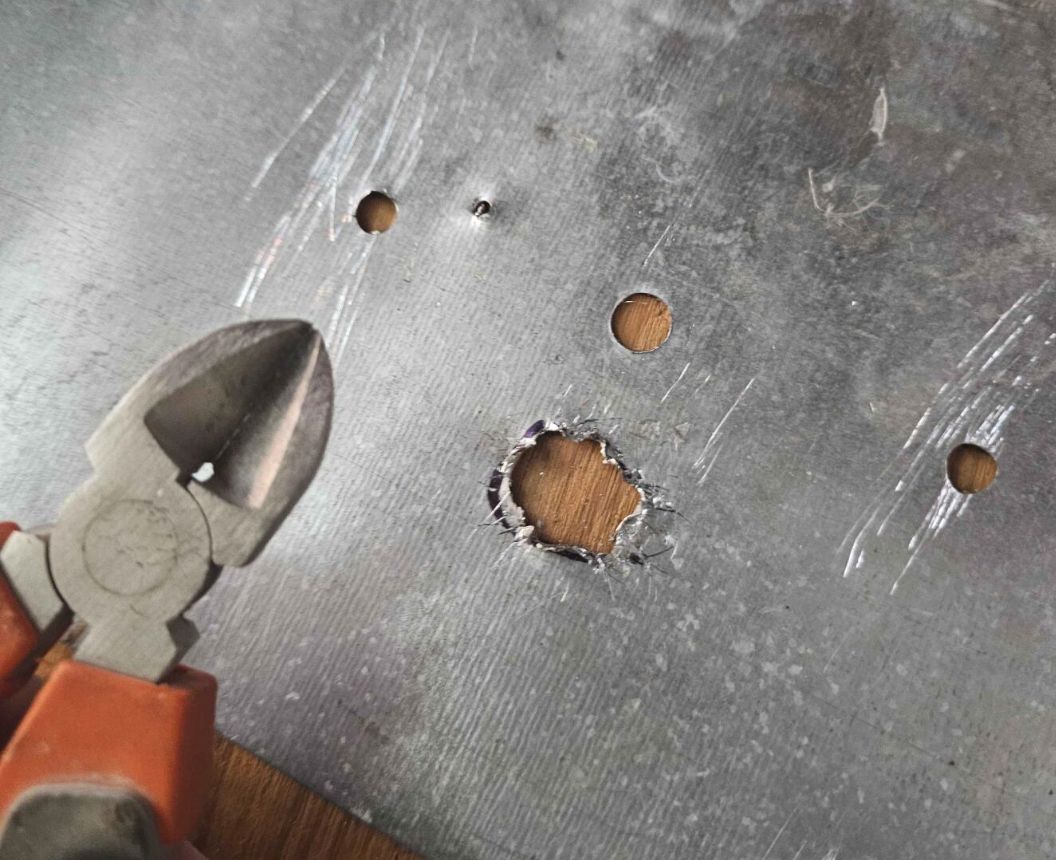 A picture of the plate with the big SMA hole mangled out.