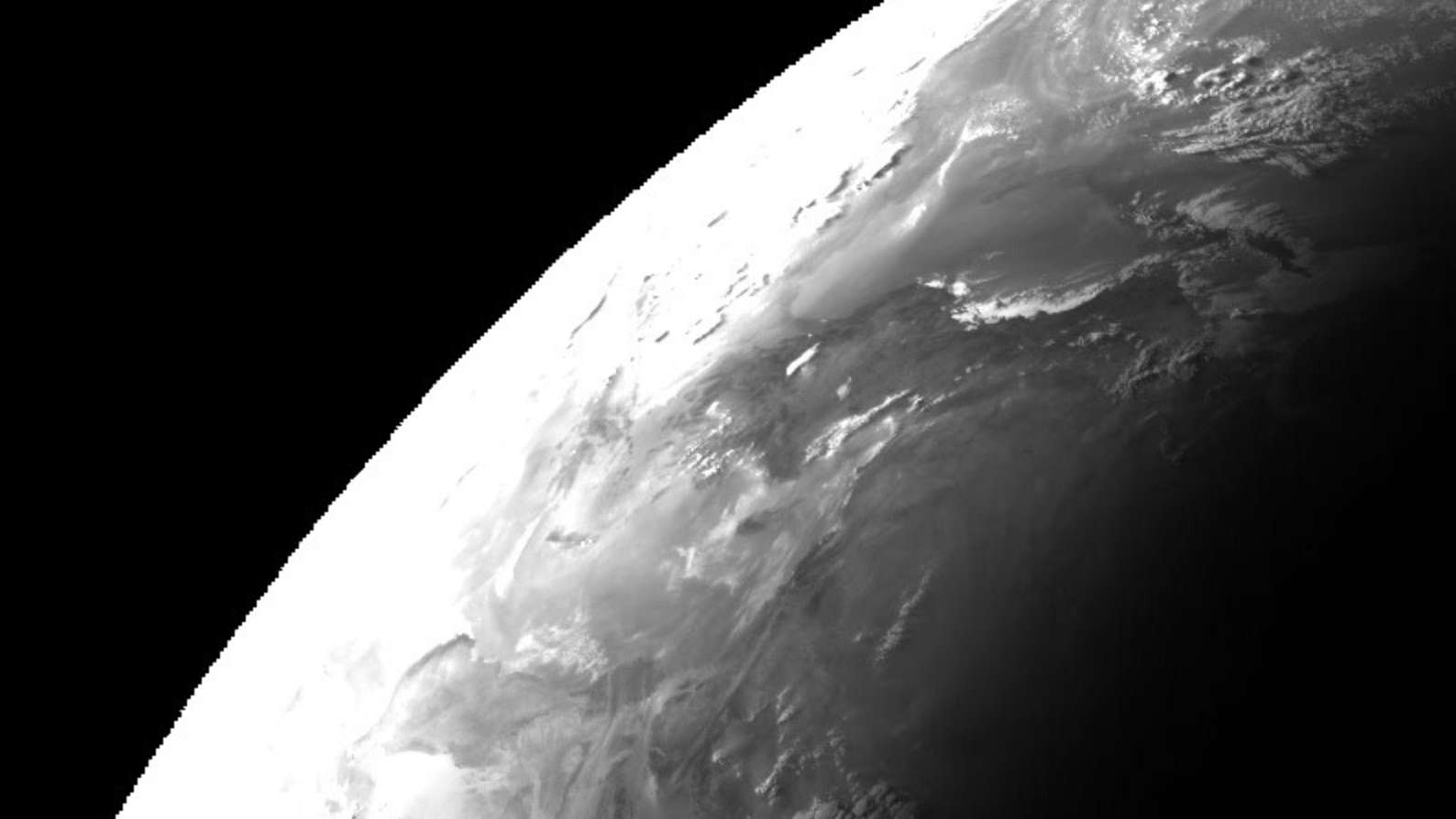 A crop as stated below showing an extremely overexposed edge of the Earth